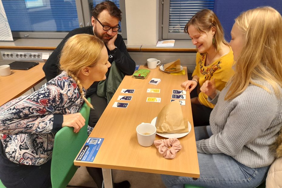 People playing Climate Call during an event to launch the game in Finland.