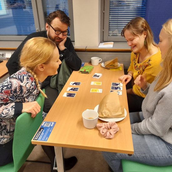 People playing Climate Call during an event to launch the game in Finland.